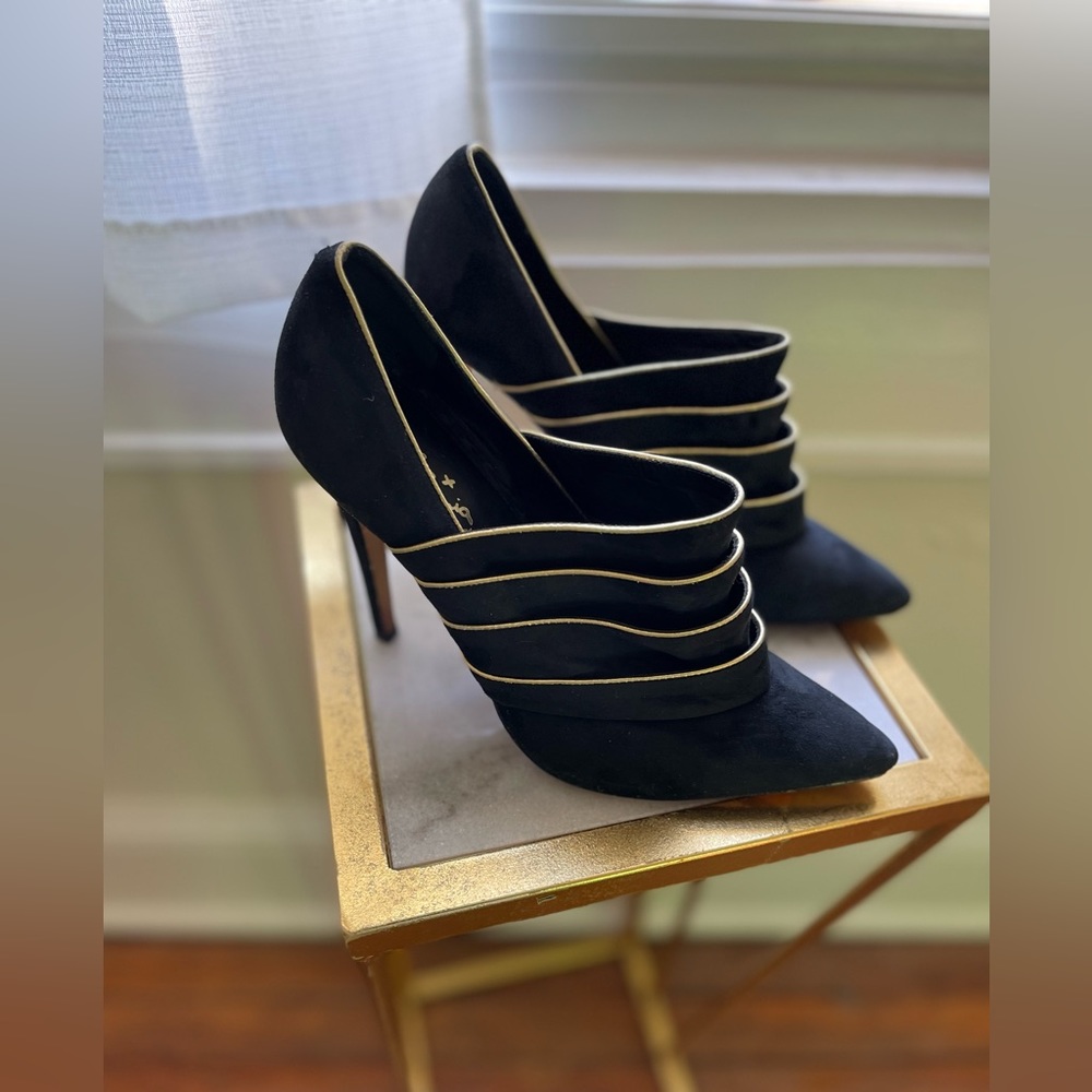 Alice and Olivia Black and Gold trimmed high heal booties.